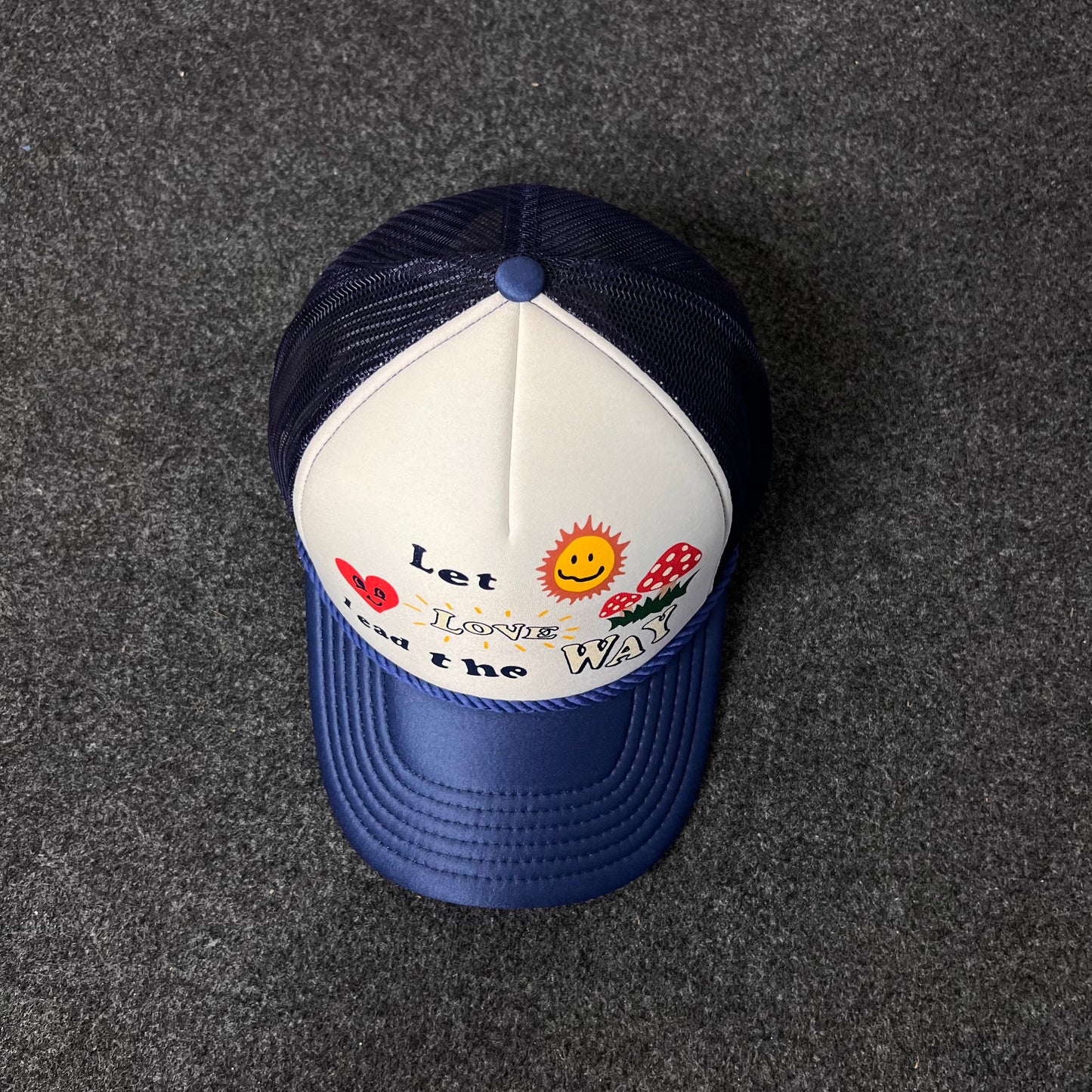 A Trucker Hat with a "Let Love Lead the Way" graphic.