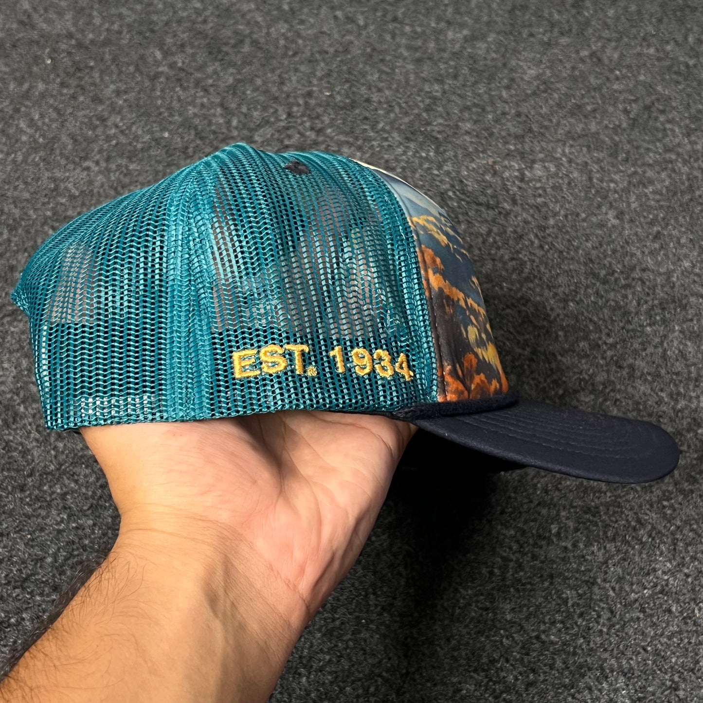 Trucker Hat featuring a nature-inspired landscape design