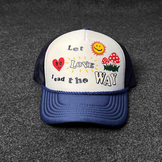 A Trucker Hat with a "Let Love Lead the Way" graphic.