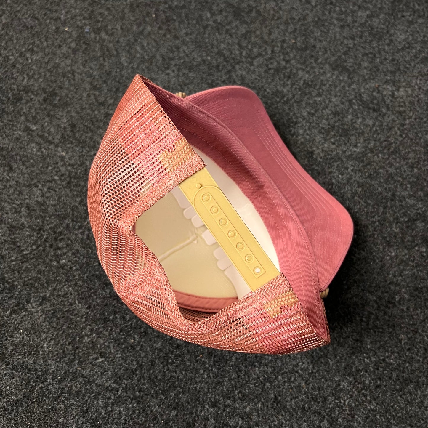 A Trucker Hat with a Sunset And Palm Trees Patch.