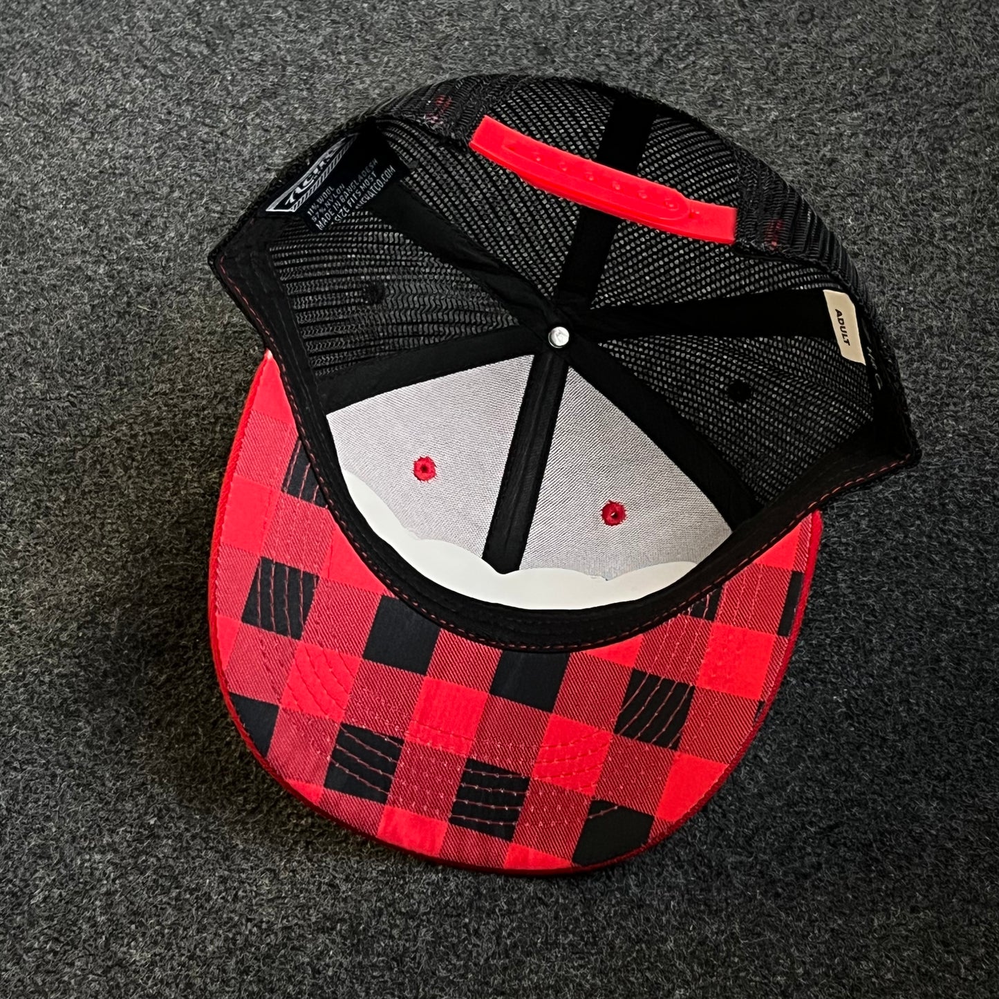 Patriotic Trucker Hat with A Leather Patch featuring A Distressed American Flag and A Knife