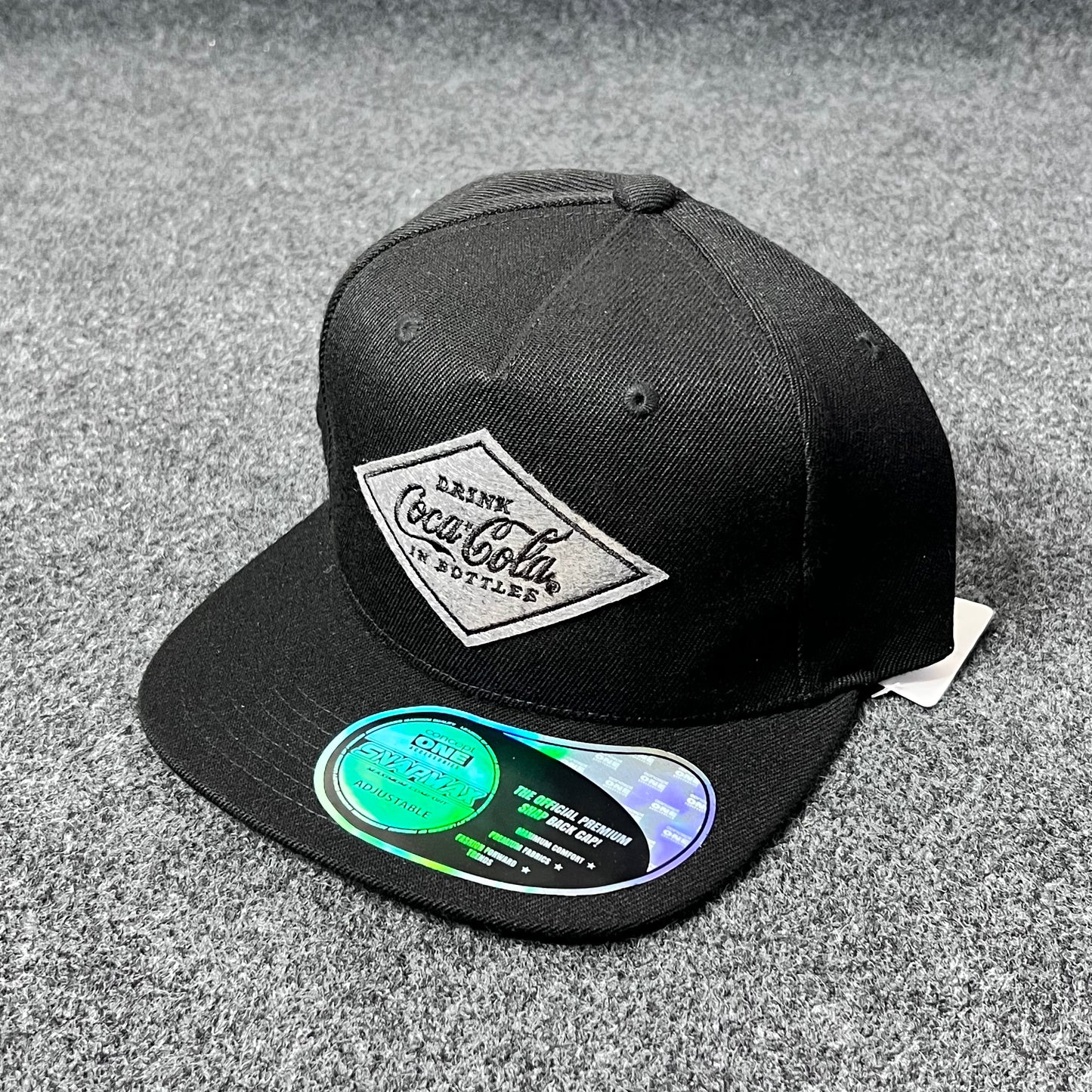 Black Coca-Cola branded Snapback Hat.