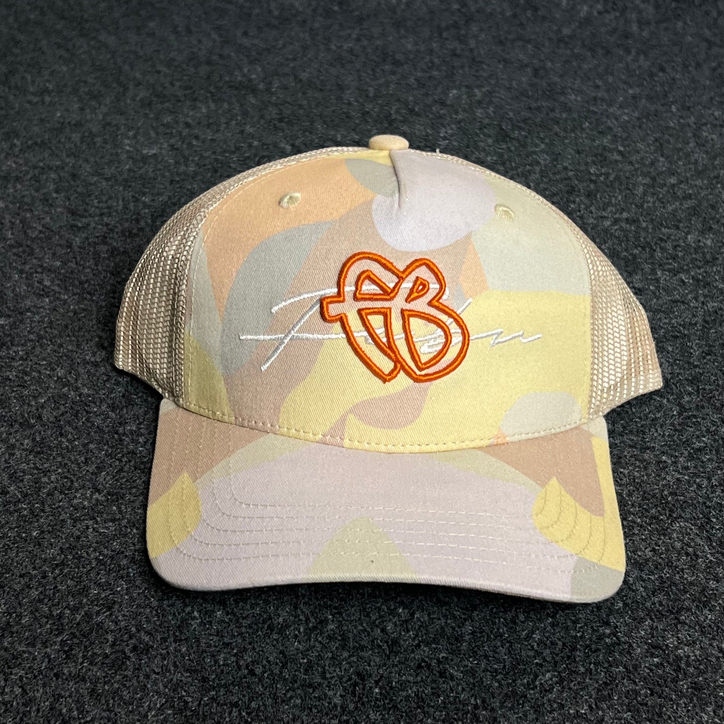 Beige Camo Mesh Trucker Cap โ Orange Embroidered Logo