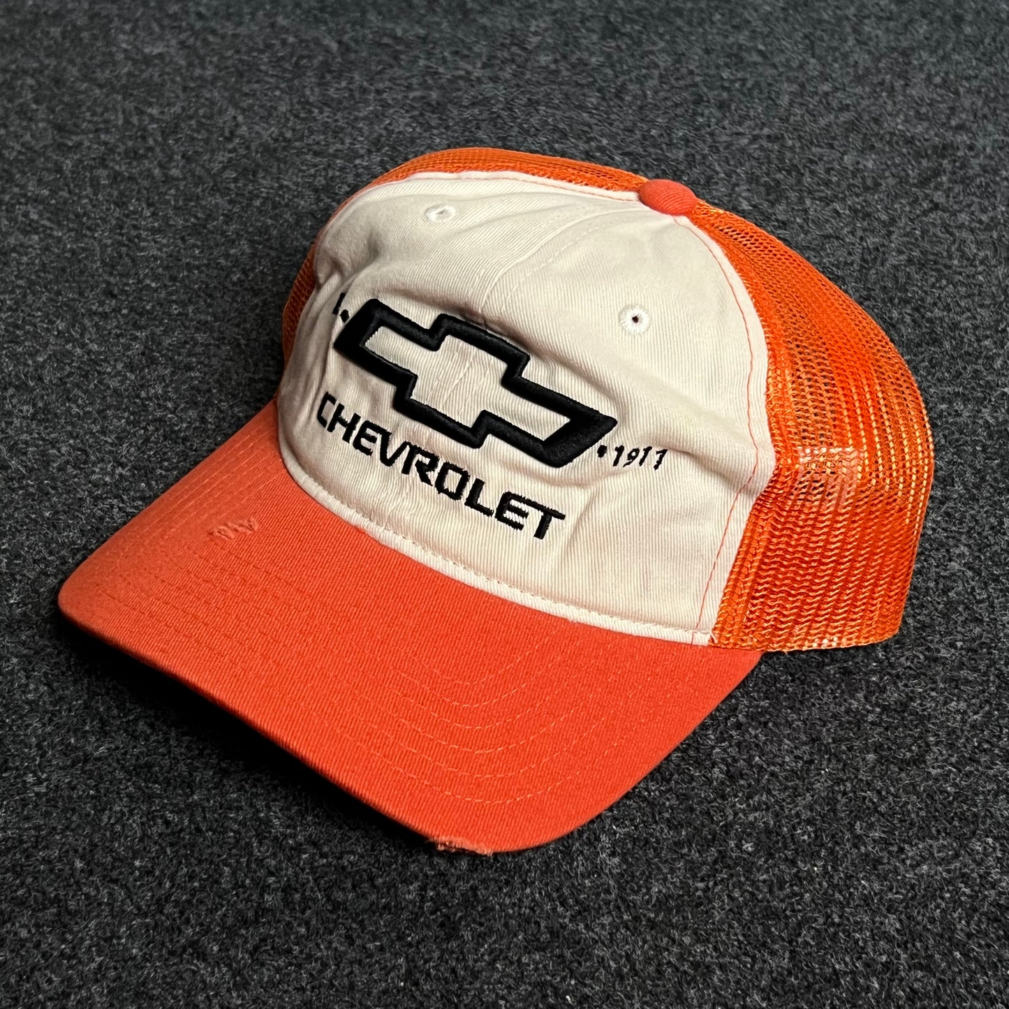 Chevrolet Mesh Trucker Cap โ Orange & Cream Design