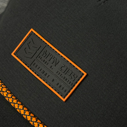 MTN OPS Base Cap (in the Black/Orange colorway)