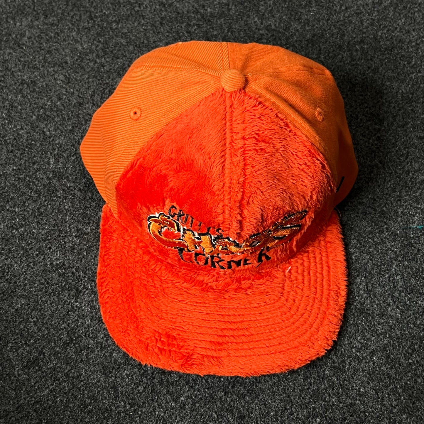 Capelli Sport “Chaos Corner” Fuzzy Flat Cap – Bright Orange