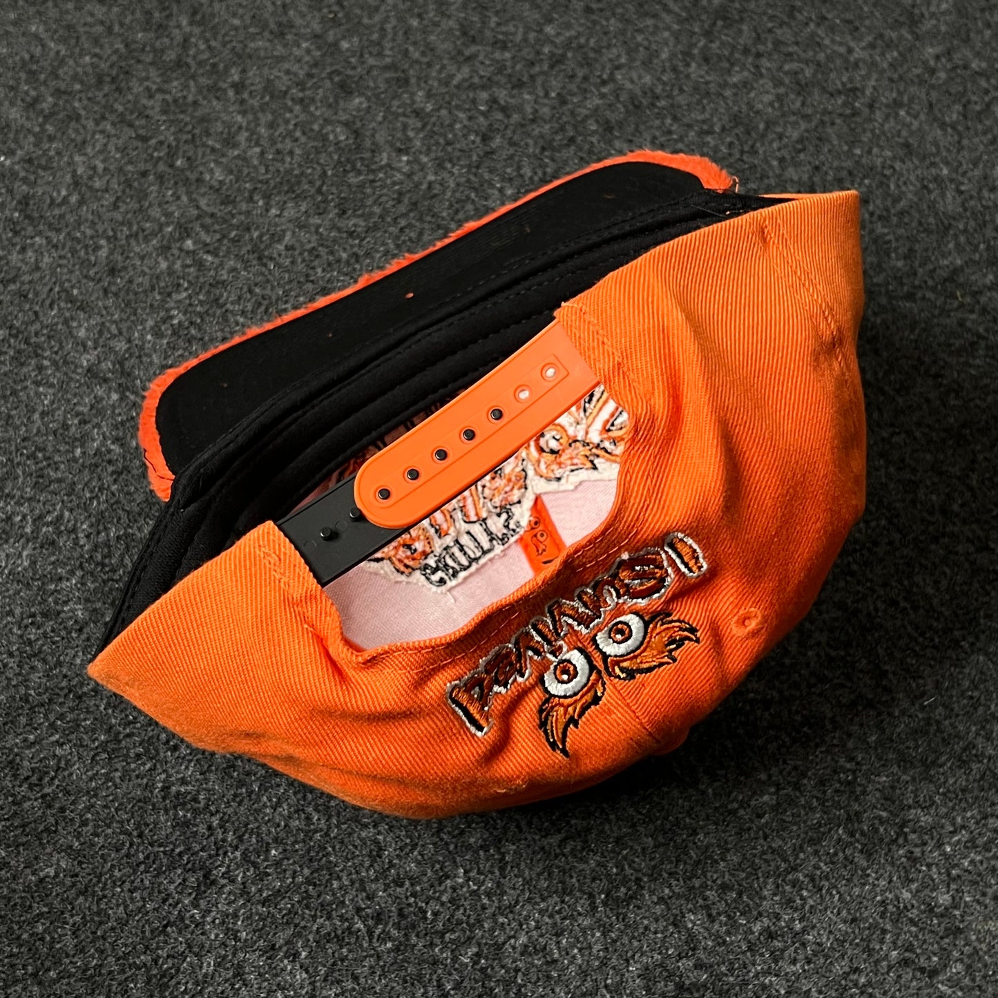 Capelli Sport “Chaos Corner” Fuzzy Flat Cap – Bright Orange