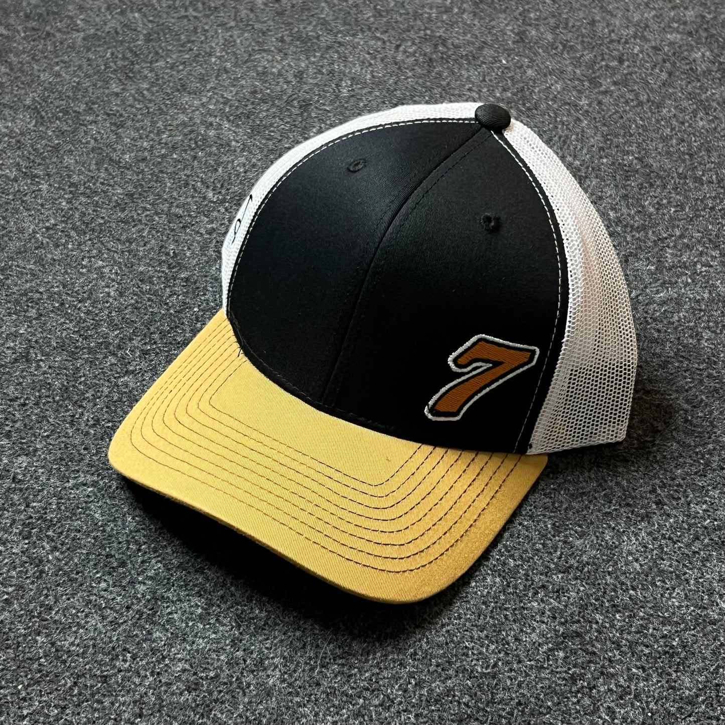 Number 7 Trucker Hat – Black, White & Gold Mesh Snapback