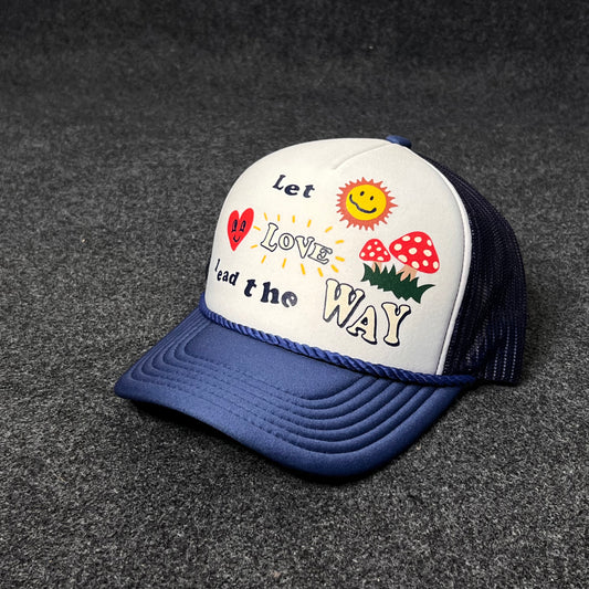 A Trucker Hat with a "Let Love Lead the Way" graphic.