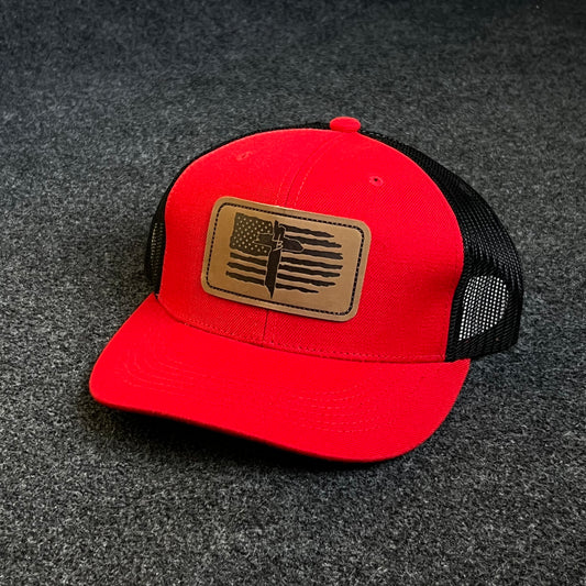 Patriotic Trucker Hat with A Leather Patch featuring A Distressed American Flag and A Knife