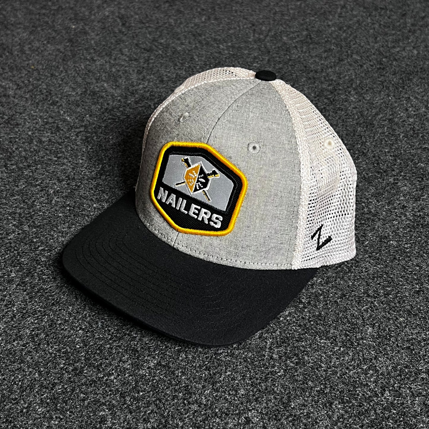 Wheeling Nailers Zephyr Suit Trucker Hat.