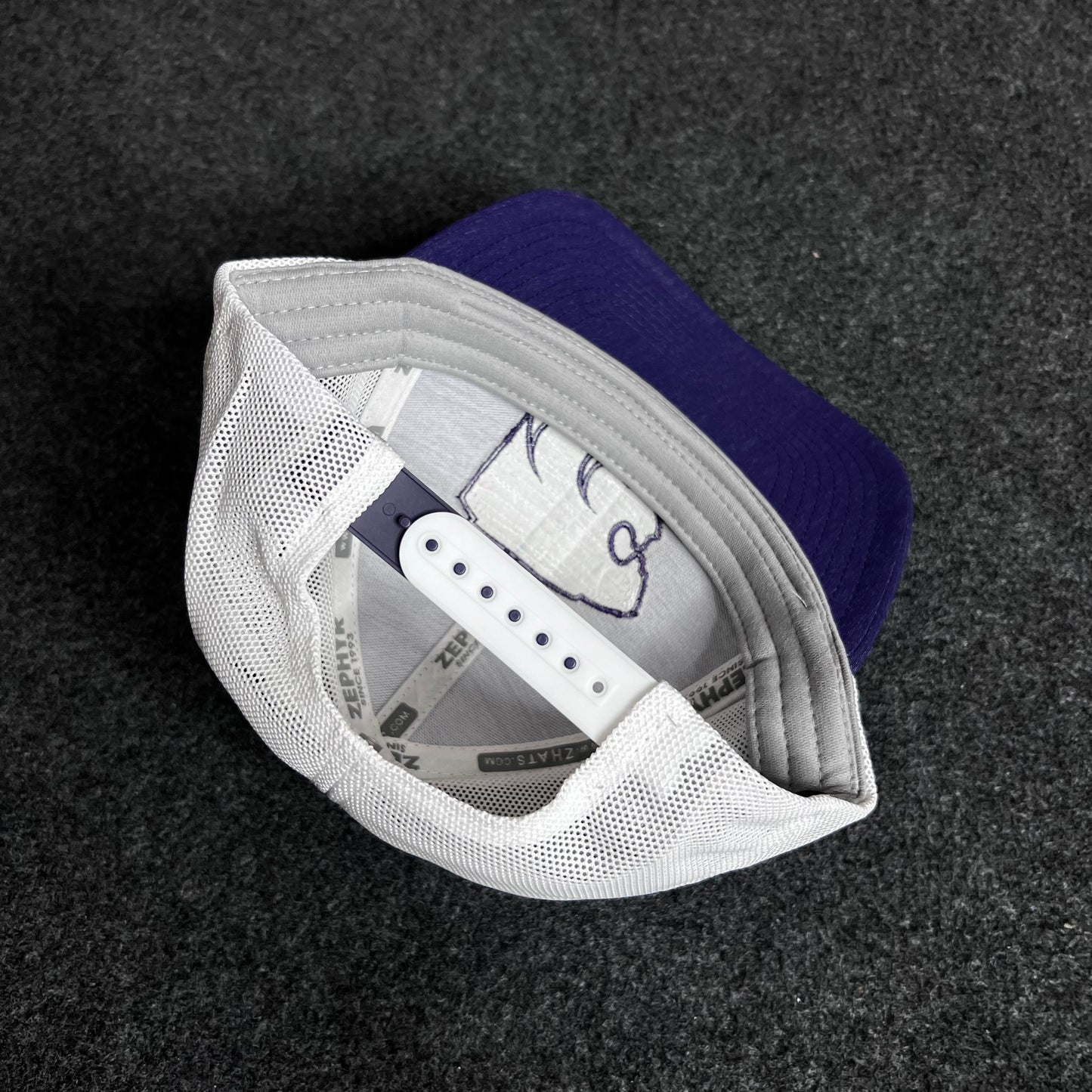 Kansas State University Wildcats trucker cap.