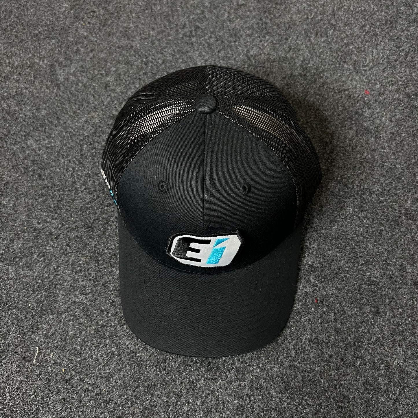 EI Logo Trucker Hat – Black Mesh Cap