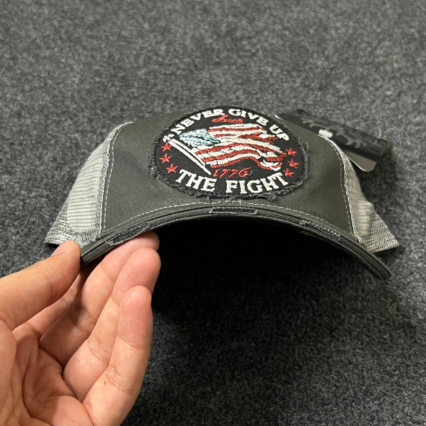 “Never Give Up The Fight” Trucker Hat
