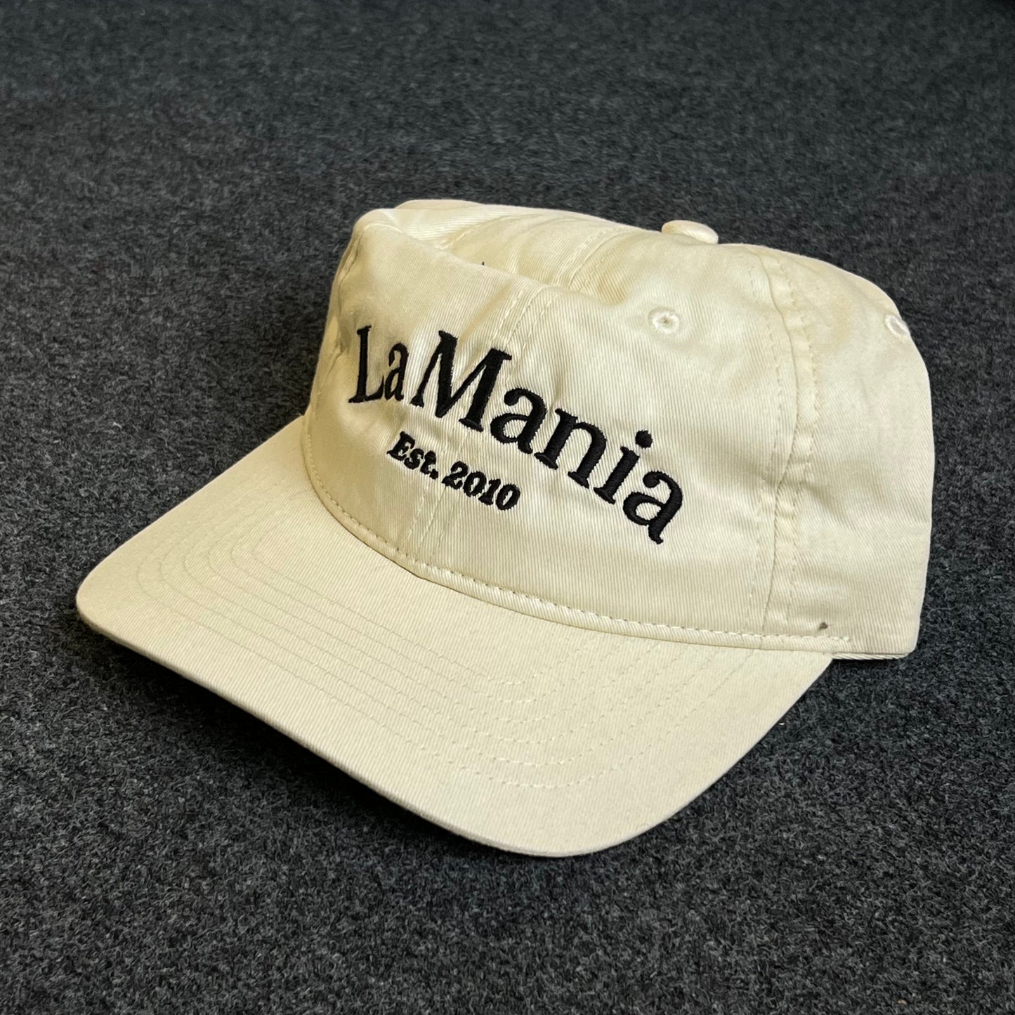 Unstructured Dad Cap – Cream “La Mania – Est. 2010”