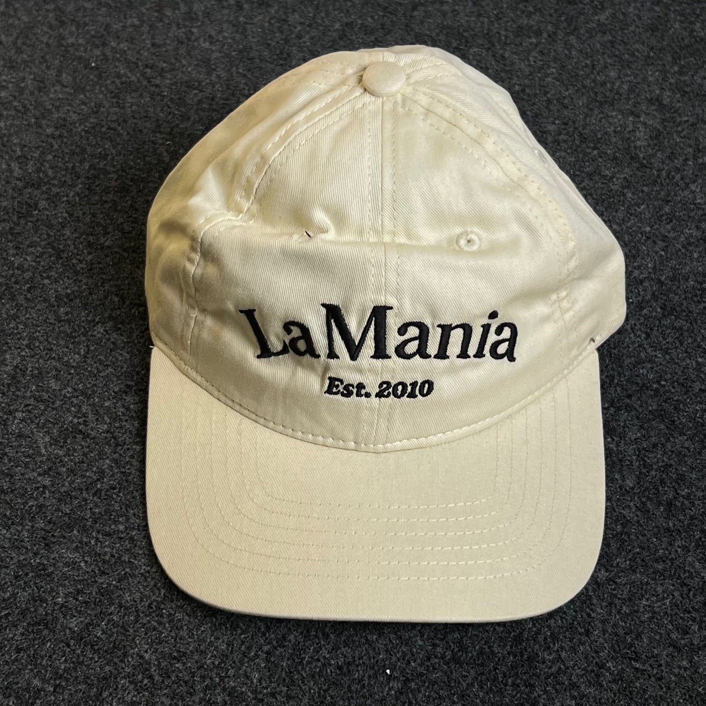 Unstructured Dad Cap – Cream “La Mania – Est. 2010”