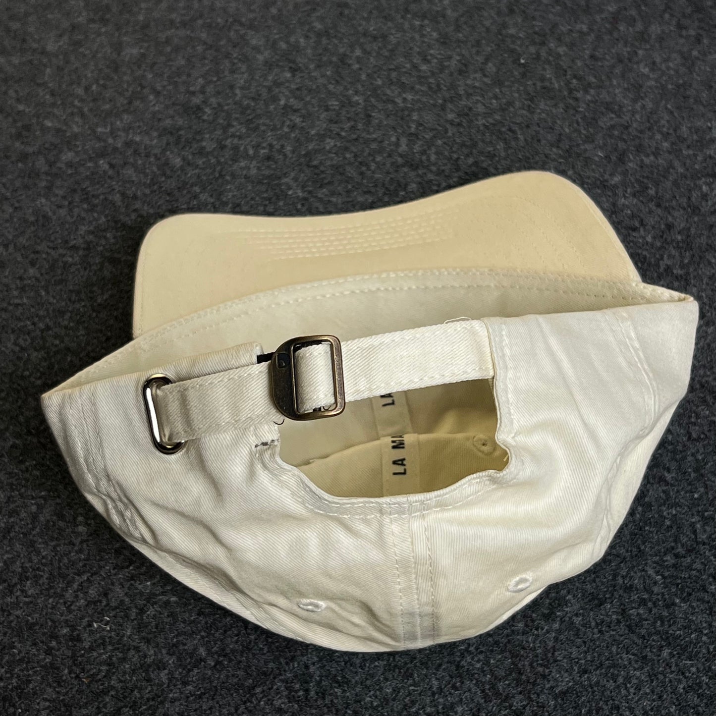 Unstructured Dad Cap – Cream “La Mania – Est. 2010”