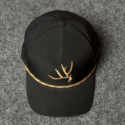 Muley Freak PRO Elk Shed Rope Trucker Cap (in the Black/Gold colorway)
