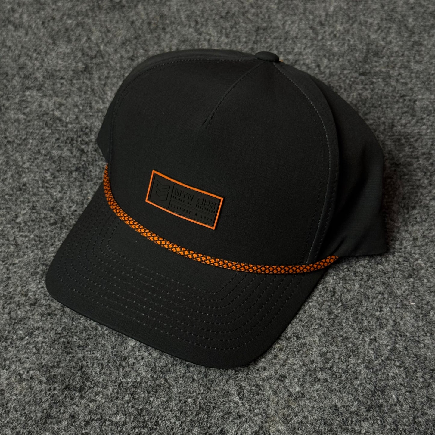 MTN OPS Base Cap (in the Black/Orange colorway)