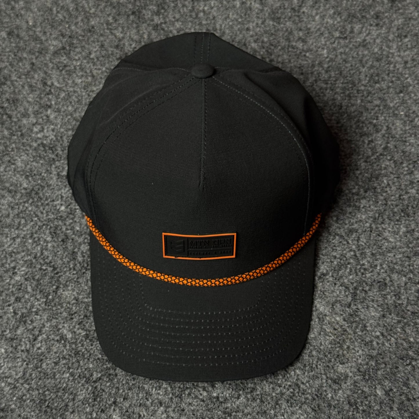 MTN OPS Base Cap (in the Black/Orange colorway)