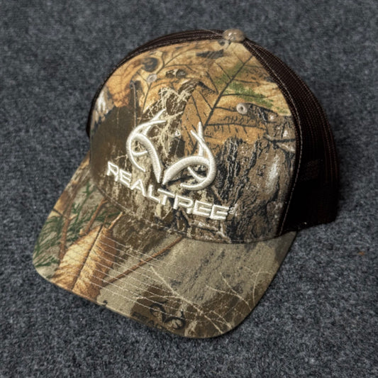 Realtree Men's Camo Hunting Trucker Cap with a 3D Embroidered Antler Logo.