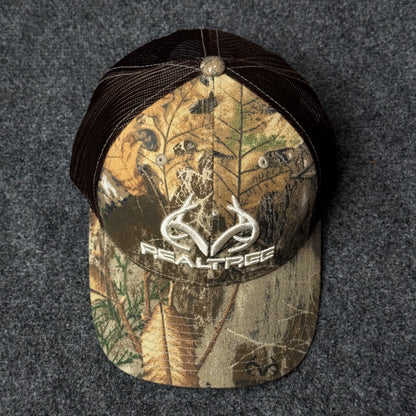 Realtree Men's Camo Hunting Trucker Cap with a 3D Embroidered Antler Logo.