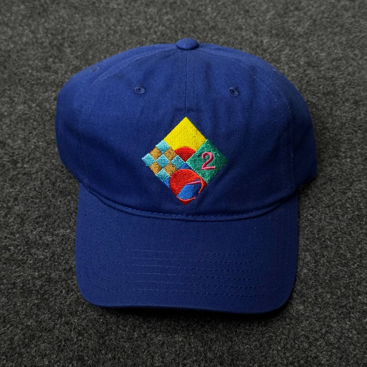 Blue Cap with A Geometric Patch Featuring The Number 2